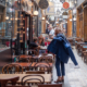 Terrasse de cafe déserte dans le passage couvert des Panoramas a Paris.